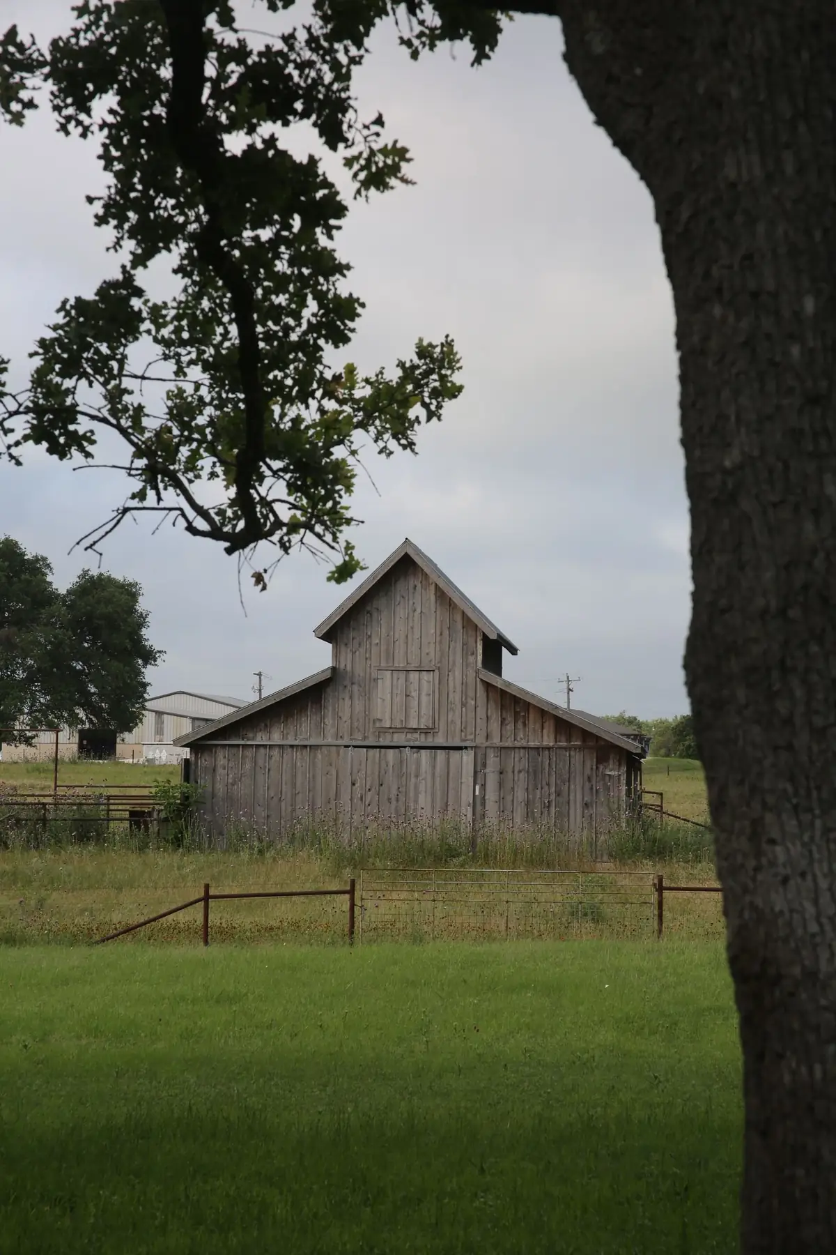 A wooden barn in open rural countryside (representative stock photo, not this specific area)