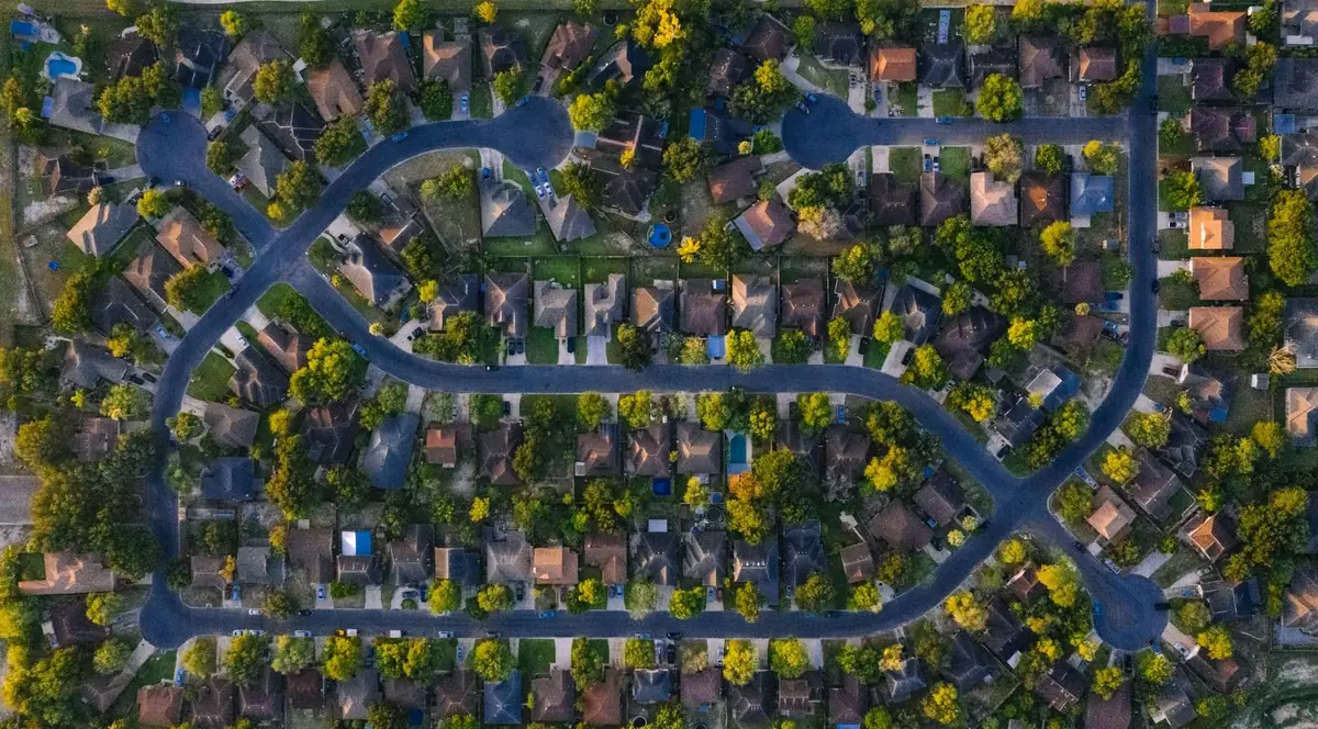 Aerial view of a curving suburban Texas neighborhood street layout (representative stock photo, not this specific area)
