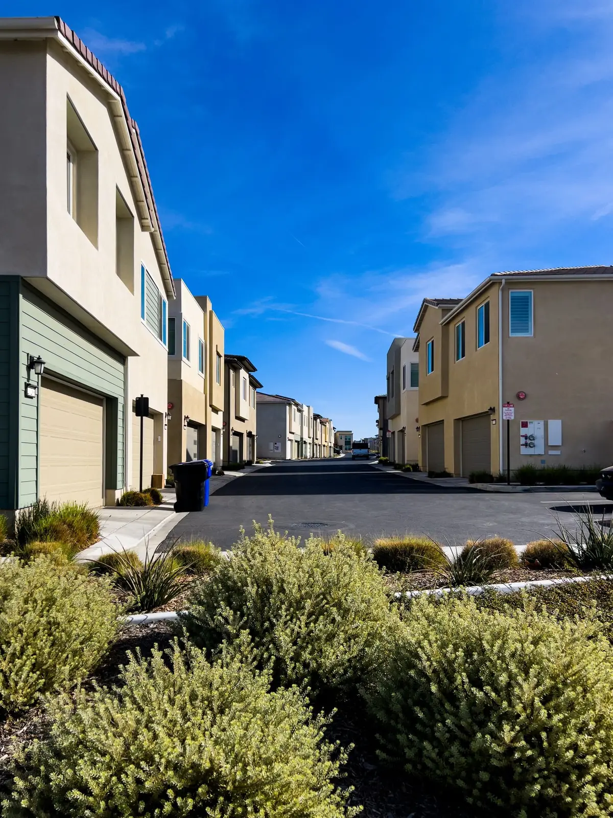 A quiet suburban residential street with modern homes (representative stock photo, not this specific area)